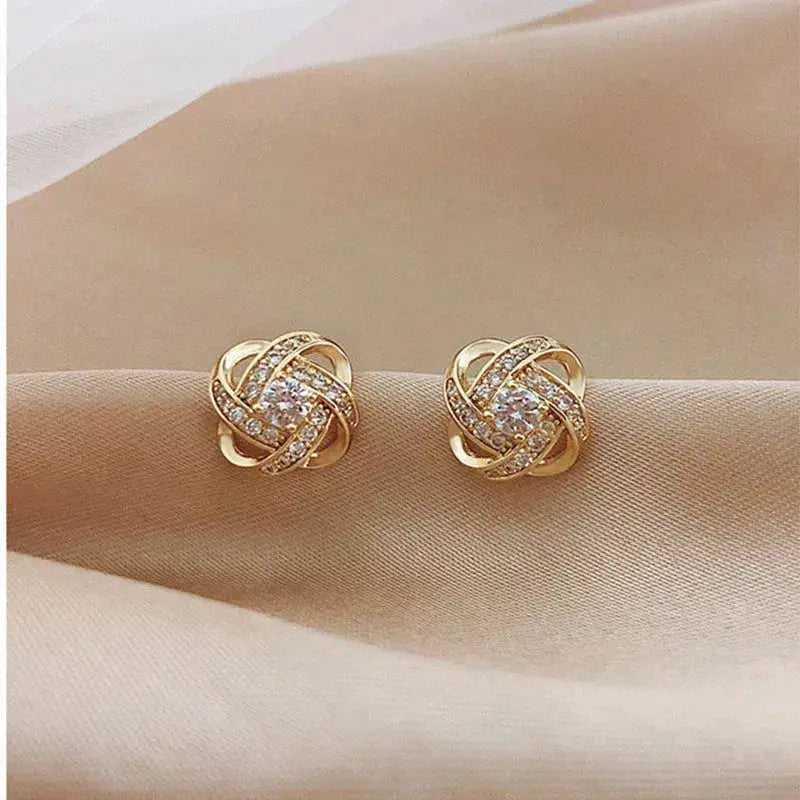 ÉCLAT | Pendientes Dorados Espiral Floral con Cristales